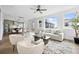 Bright, open-concept living space with hardwood floors, modern furniture, and abundant natural light at 924 Sunflower St, Louisville, CO 80027