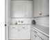 Well-organized pantry with white cabinets, quartz countertops, and stylish decor at 924 Sunflower St, Louisville, CO 80027