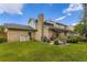 This home has a well-manicured lawn, lovely landscaping and a brick exterior at 5723 S Kittredge St, Centennial, CO 80015