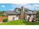 Beautiful brick home featuring a private backyard with a lush lawn and a patio area at 5723 S Kittredge St, Centennial, CO 80015