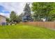 This home features a large, grassy backyard and mature trees for privacy and shade at 5723 S Kittredge St, Centennial, CO 80015