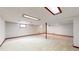 Spacious basement featuring carpet flooring, support beam, and recessed lights at 5723 S Kittredge St, Centennial, CO 80015