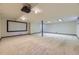 This spacious basement features a projector and screen and lots of extra room at 5723 S Kittredge St, Centennial, CO 80015