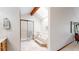 Bright bathroom with a glass shower, soaking tub on a raised platform, and a skylight at 5723 S Kittredge St, Centennial, CO 80015