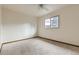 Bright bedroom with a large window and neutral decor at 5723 S Kittredge St, Centennial, CO 80015