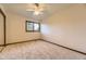 Cozy bedroom featuring a large window and a ceiling fan at 5723 S Kittredge St, Centennial, CO 80015