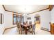 Dining room with wood table and chairs, arched entryways, and natural lighting at 5723 S Kittredge St, Centennial, CO 80015