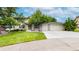 Charming brick home featuring a lush front lawn, two-car garage, and mature shade trees at 5723 S Kittredge St, Centennial, CO 80015