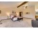 Spacious main bedroom with vaulted ceiling, ceiling fan, and a cozy seating area at 5723 S Kittredge St, Centennial, CO 80015