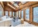 Cozy sunroom with natural wood, skylights, many windows, and tile floor, perfect for year-round enjoyment at 5723 S Kittredge St, Centennial, CO 80015