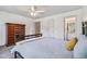 Bedroom with carpet and ceiling fan includes closet and bathroom access at 2154 S Parfet Dr, Lakewood, CO 80227