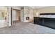 Bedroom with a fireplace, carpeted floor, and neutral decor for relaxation at 2154 S Parfet Dr, Lakewood, CO 80227