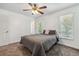 This bedroom features carpet, white walls, and natural light from the windows at 2154 S Parfet Dr, Lakewood, CO 80227