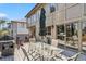 Exterior of a wooden deck with seating, a table and an umbrella at 2154 S Parfet Dr, Lakewood, CO 80227