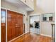 A foyer with hardwood floors, paneled doors, and a study or office room at 2154 S Parfet Dr, Lakewood, CO 80227