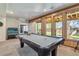 Game room featuring a pool table and outdoor access at 2154 S Parfet Dr, Lakewood, CO 80227