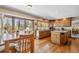 Eat-in kitchen with bright lighting, a large island, and hardwood floors at 2154 S Parfet Dr, Lakewood, CO 80227