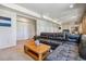 Living room featuring carpet flooring, a comfortable sectional sofa, and neutral paint at 2154 S Parfet Dr, Lakewood, CO 80227