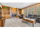 Cozy living room with fireplace, custom built-ins, and comfortable seating at 2154 S Parfet Dr, Lakewood, CO 80227