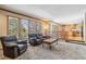 Open-concept living room flows seamlessly into the kitchen and dining area at 2154 S Parfet Dr, Lakewood, CO 80227