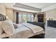 Main bedroom with a plush bed, windows, and modern decor for comfort at 2154 S Parfet Dr, Lakewood, CO 80227