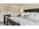 Main bedroom with fireplace and a love sign over the mantle at 2154 S Parfet Dr, Lakewood, CO 80227