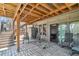 Relax on the covered patio with tile flooring, stairs, and sliding glass doors offering seamless indoor-outdoor living at 2154 S Parfet Dr, Lakewood, CO 80227