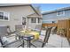 Backyard patio with comfortable outdoor seating and view of home and backyard at 8345 Moore St, Arvada, CO 80005