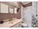 Bathroom featuring a large vanity, integrated shower, and tiled walls at 8345 Moore St, Arvada, CO 80005