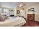 Bedroom featuring a wooden ceiling fan, wood floors, and ample natural light at 8345 Moore St, Arvada, CO 80005