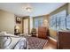 Comfortable bedroom boasts two windows, a ceiling fan and a decorative area rug at 8345 Moore St, Arvada, CO 80005