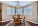 Cozy dining area with a chandelier and plenty of natural light at 8345 Moore St, Arvada, CO 80005