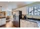 Spacious kitchen with stainless steel appliances and adjacent dining area at 8345 Moore St, Arvada, CO 80005