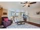 Bright and open living room with hardwood floors, natural light and a ceiling fan at 8345 Moore St, Arvada, CO 80005