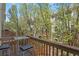 Relaxing balcony with seating, perfect for enjoying the serene views of the surrounding trees and neighborhood at 3680 S Beeler St # 5, Denver, CO 80237