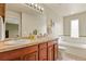 Spacious bathroom featuring a double sink vanity, a soaking tub, and plenty of natural light at 3680 S Beeler St # 5, Denver, CO 80237