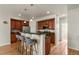 Inviting kitchen with a bar countertop, stainless appliances, and ample cabinet space at 3680 S Beeler St # 5, Denver, CO 80237