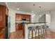 Stylish kitchen with stainless steel appliances, dark wood cabinets, and bar seating at 3680 S Beeler St # 5, Denver, CO 80237
