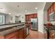 Spacious kitchen featuring granite countertops, stainless steel appliances, and a breakfast bar at 3680 S Beeler St # 5, Denver, CO 80237