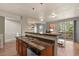 Open kitchen with a view to the living room, stainless steel appliances, and a breakfast bar at 3680 S Beeler St # 5, Denver, CO 80237
