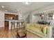 Bright living area with hardwood floors flowing into the kitchen and dining spaces at 3680 S Beeler St # 5, Denver, CO 80237