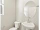 This bathroom has a single sink vanity, an oval mirror, and a modern faucet at 383 Remuda Rd, Berthoud, CO 80513