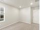 This bedroom has neutral carpet, a window with blinds, and recessed lighting at 383 Remuda Rd, Berthoud, CO 80513