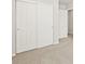 Bedroom closet featuring sliding doors and a traditional door at 383 Remuda Rd, Berthoud, CO 80513