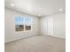 Bedroom features a window with natural light, and neutral colored walls and carpet at 383 Remuda Rd, Berthoud, CO 80513