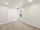 Bright bedroom features neutral carpet, closet, and a window providing natural light at 383 Remuda Rd, Berthoud, CO 80513