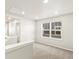 Bright room with neutral carpet and paint and view of the entryway at 383 Remuda Rd, Berthoud, CO 80513