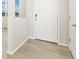 Entryway features wood-style flooring and a white front door with modern hardware at 383 Remuda Rd, Berthoud, CO 80513