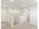 Bright hallway features neutral carpet, white walls, and access to various rooms at 383 Remuda Rd, Berthoud, CO 80513