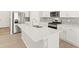 Well-equipped kitchen with stainless appliances, a white kitchen island, and modern finishes at 383 Remuda Rd, Berthoud, CO 80513